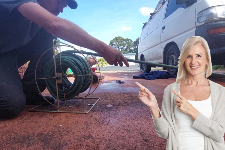 Hose neatly coiled, a ulladulla specialist finishes up a day of thorough gutter rinsing.